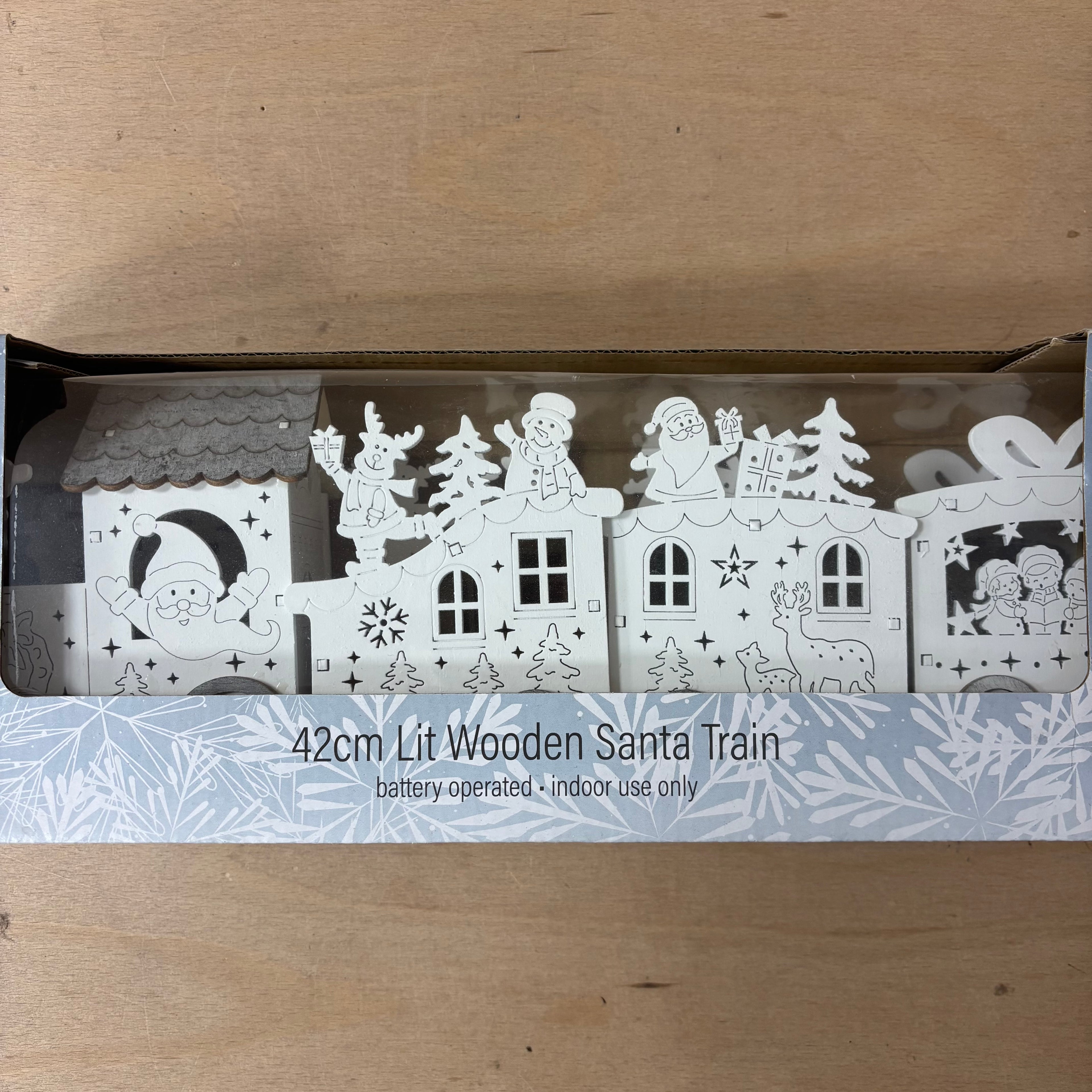 Festive lit wooden santa train