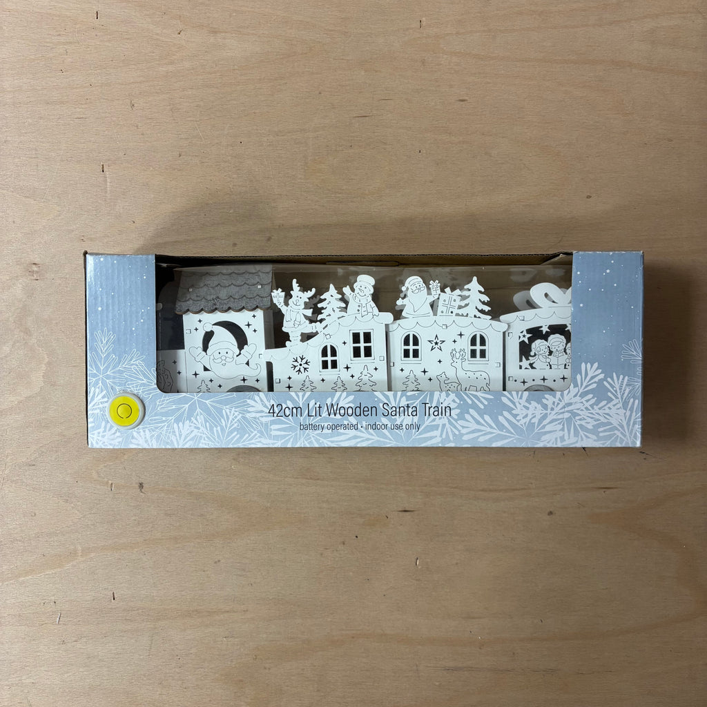 Festive lit wooden santa train