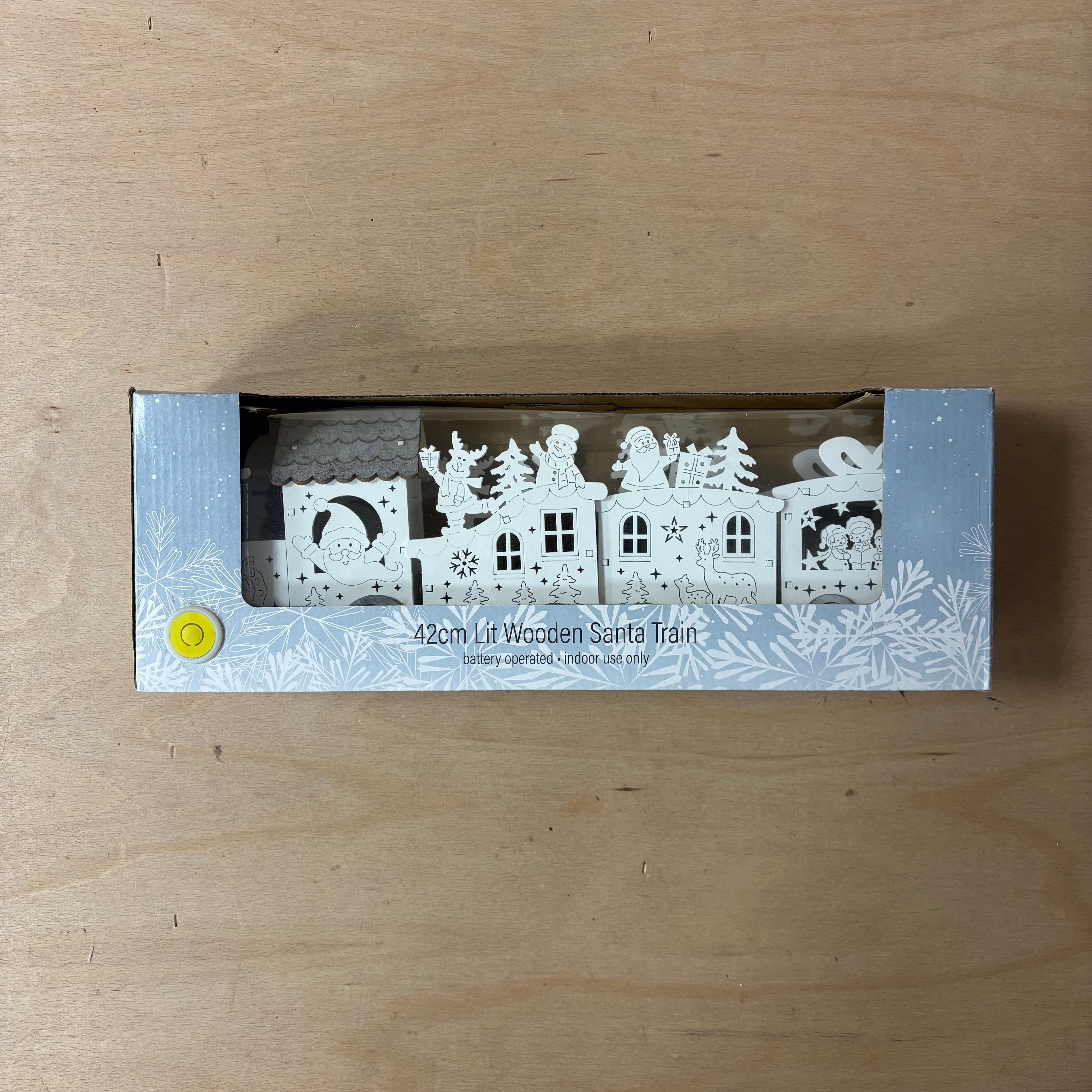 Festive lit wooden santa train