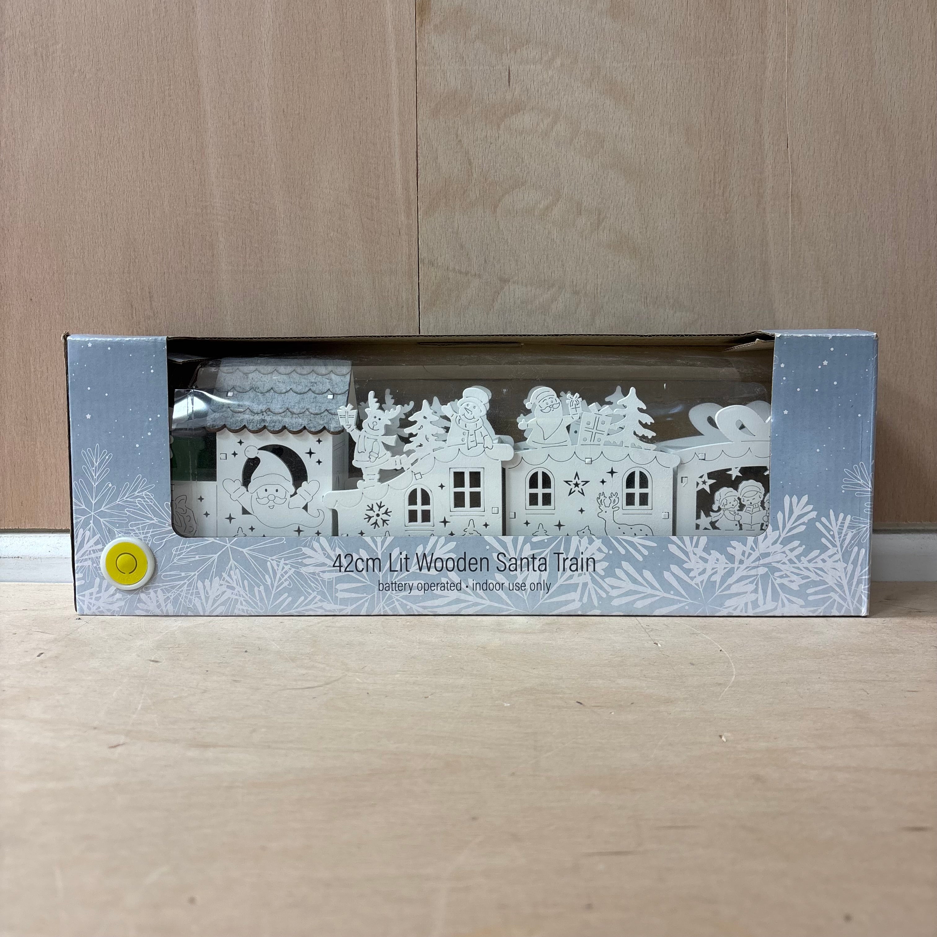 Festive lit wooden santa train