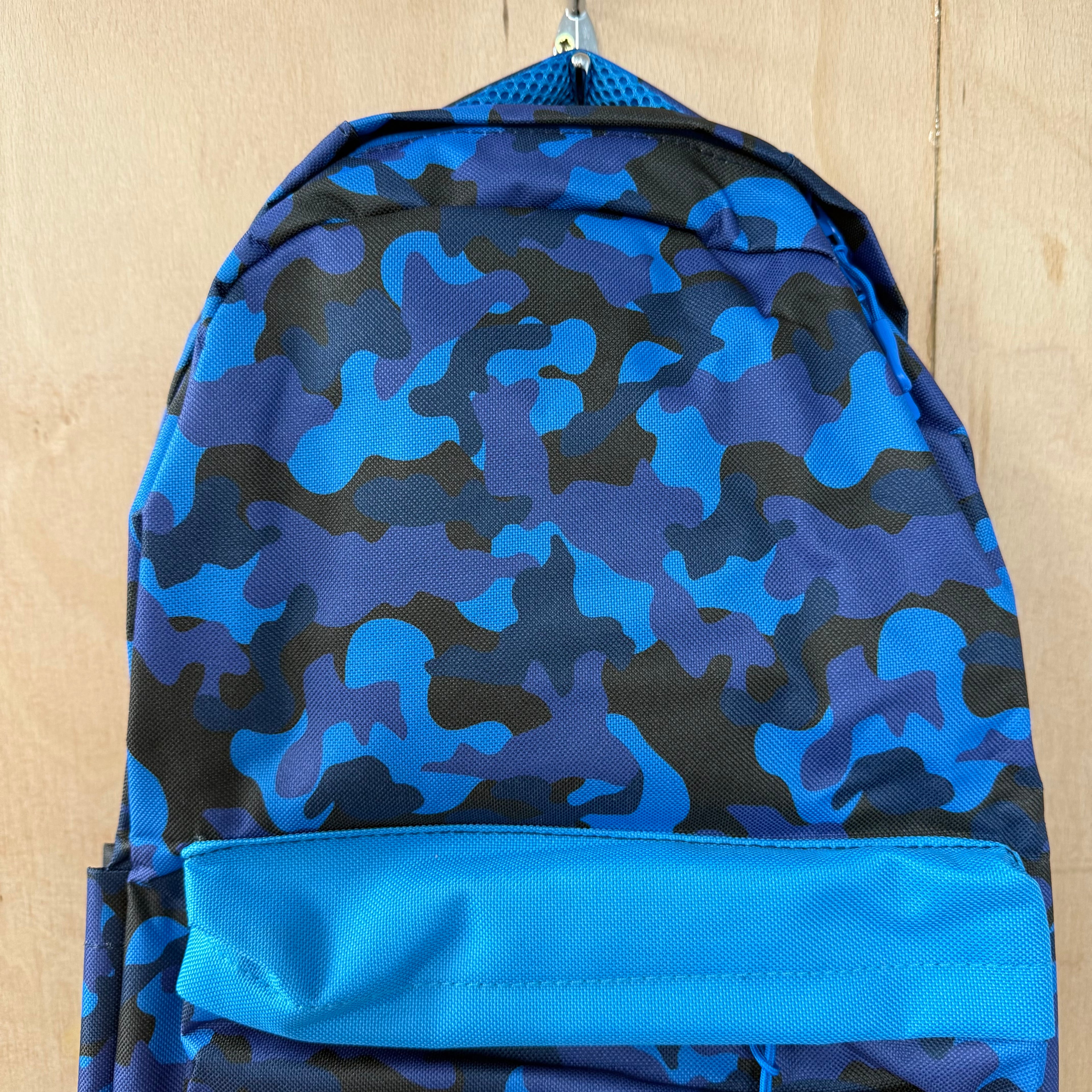 Snug children's backpack for school with camo pattern